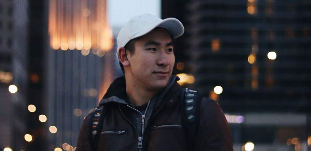 Man with white cap in city street