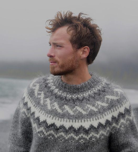 Man in sweater at beach