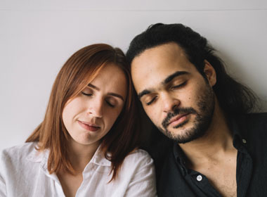 Man resting against partner