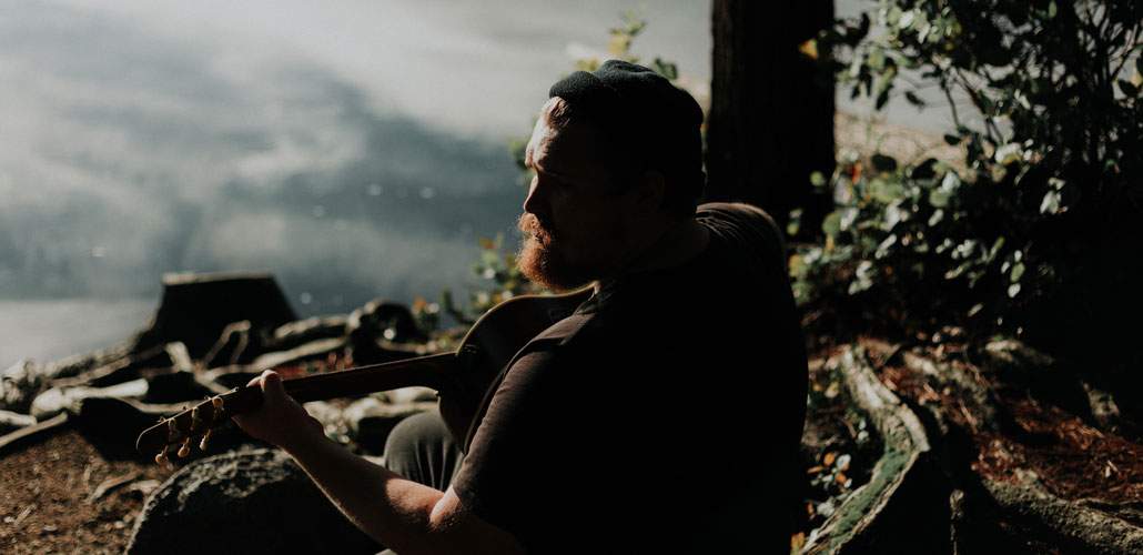 Man playing guitar in nature