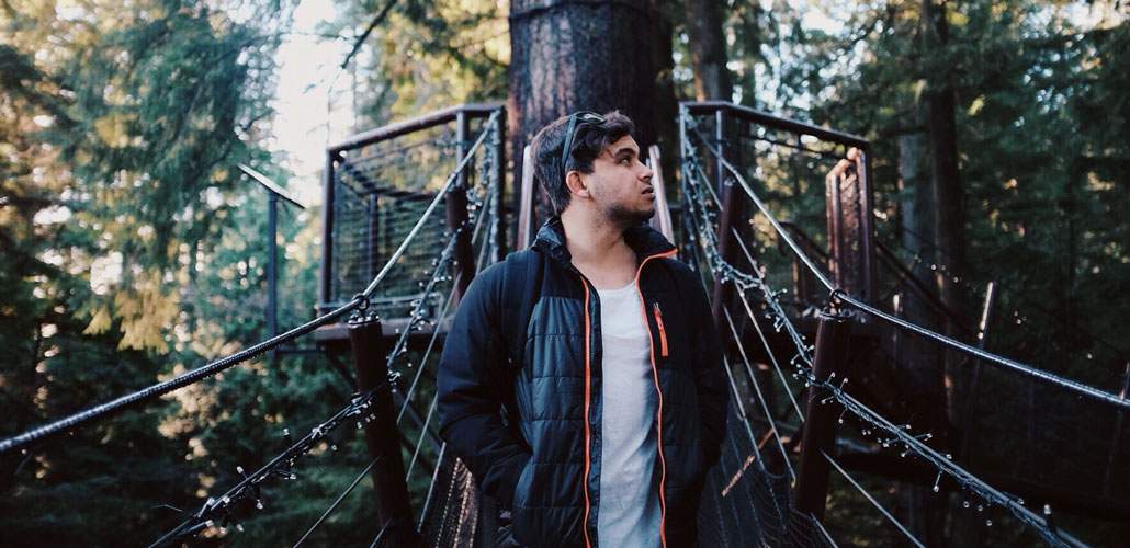 Man standing on forest canopy walk